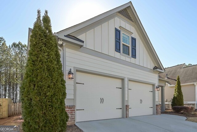 view of side of home featuring a garage