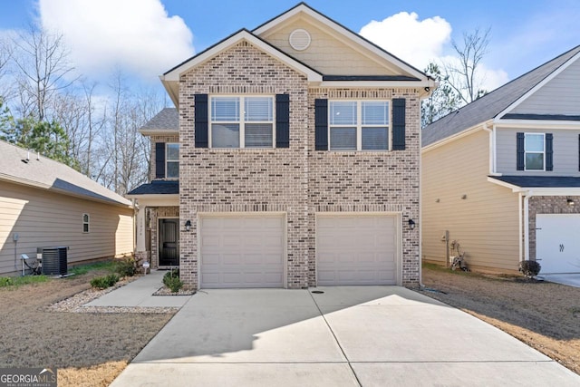 view of front of home with a garage and central air condition unit