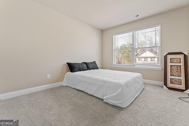 bedroom with light colored carpet