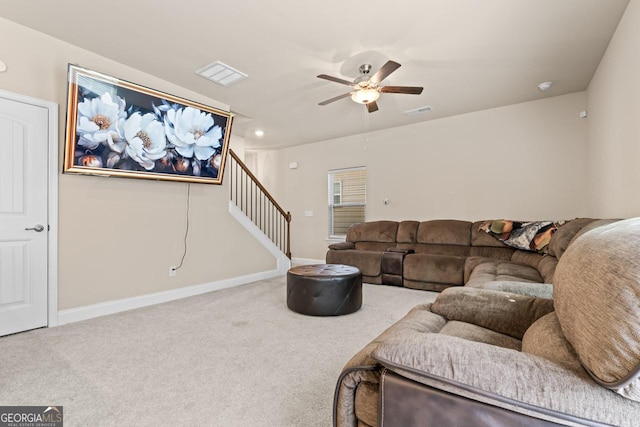 carpeted living room featuring ceiling fan