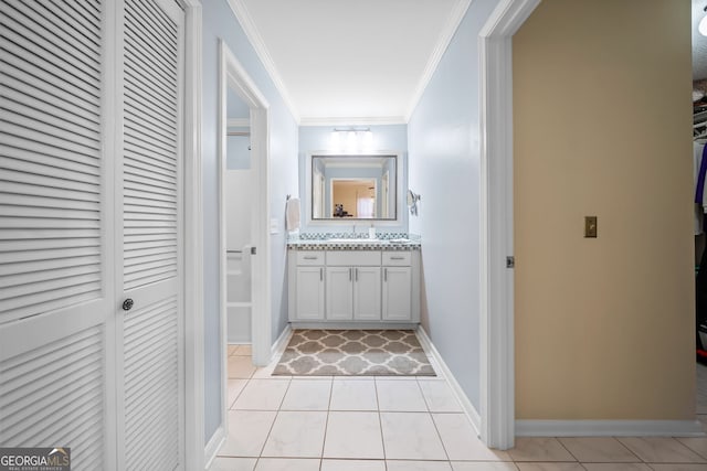 bathroom featuring vanity, tile patterned flooring, and ornamental molding