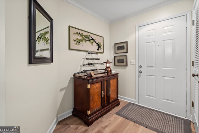 interior space featuring crown molding and light wood-type flooring