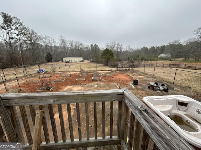 view of yard with a rural view and fence