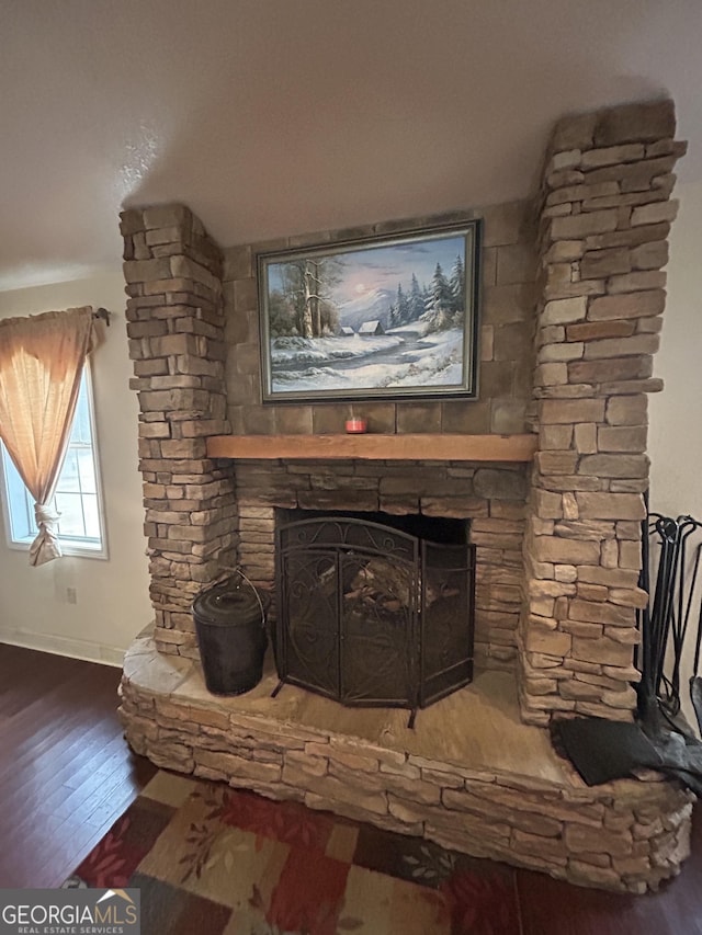 382 Lower Lovelace Rd, West Point, GA 31833 - detailed view of a fireplace, wood finished floors, and baseboards