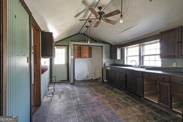 1381 Allgood Rd, Marietta, GA 30062 - kitchen with a sink, lofted ceiling, dark brown cabinetry, and a ceiling fan