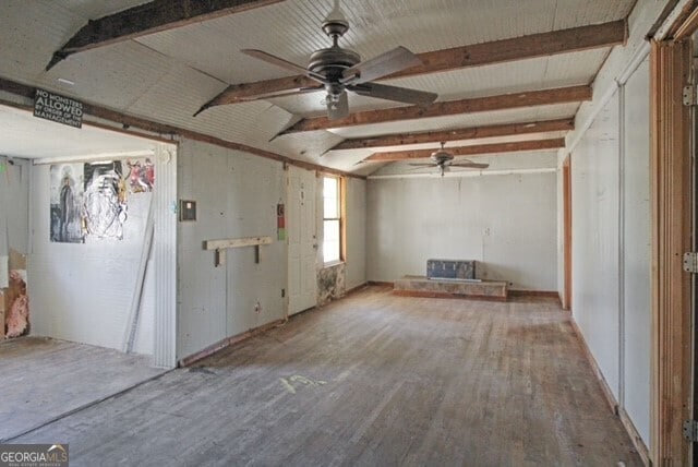 1381 Allgood Rd, Marietta, GA 30062 - unfurnished living room with a ceiling fan, vaulted ceiling with beams, and wood finished floors