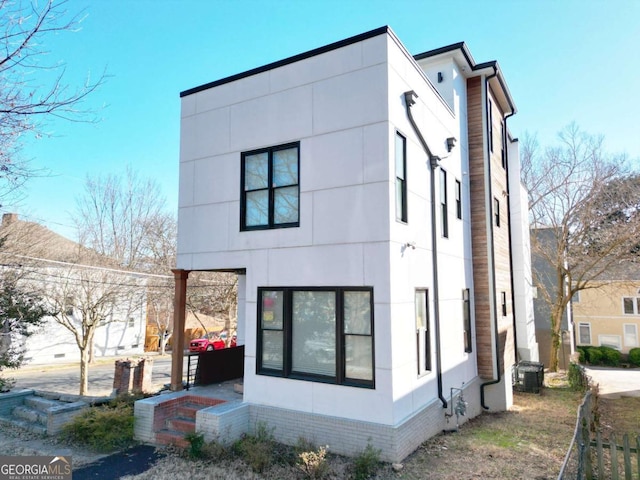 view of side of property with cooling unit