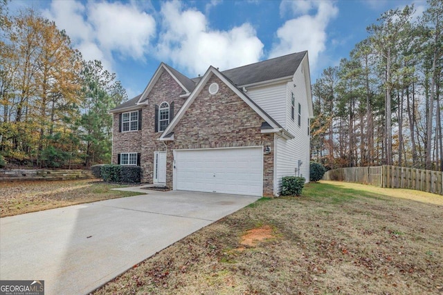 front of property with a garage and a front yard