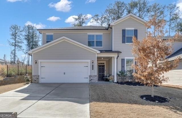 720 Lanarck Way, Peachtree City, GA 30269 - view of front facade with driveway and a garage