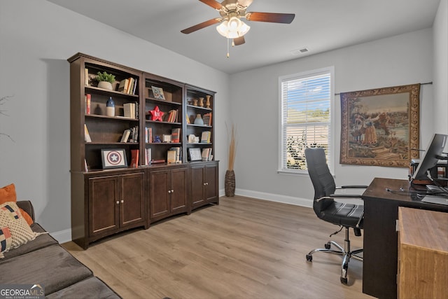 office featuring ceiling fan and light hardwood / wood-style floors