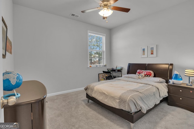 bedroom featuring light colored carpet and ceiling fan