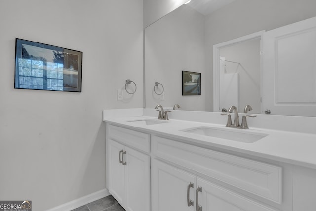 bathroom with tile patterned flooring and vanity