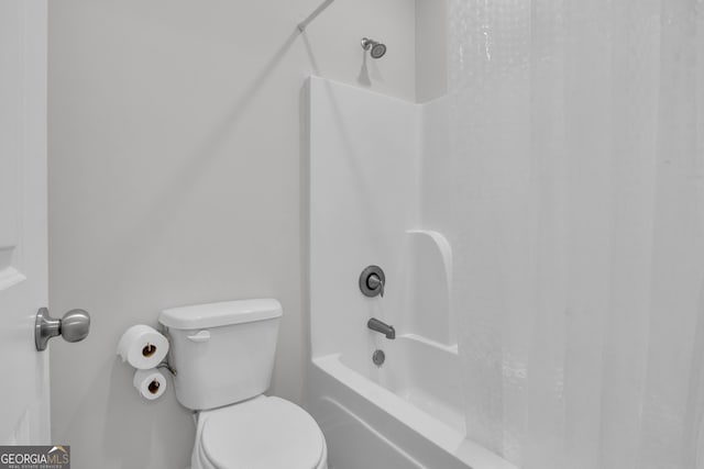 bathroom featuring toilet and shower / bathing tub combination