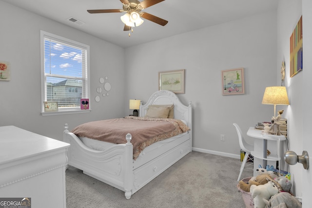 bedroom with ceiling fan and light carpet