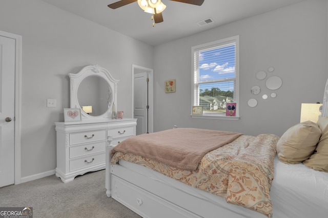 bedroom with light colored carpet and ceiling fan