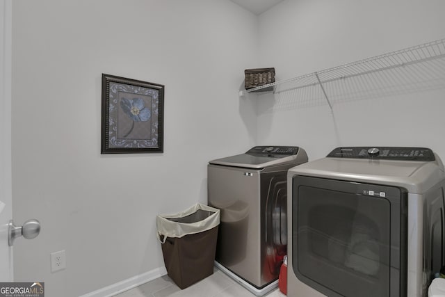 washroom with washing machine and dryer