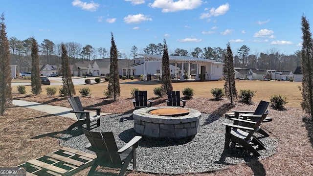 view of yard featuring a fire pit