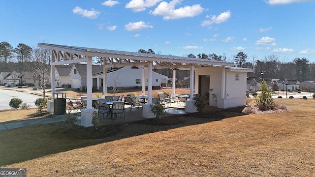 back of house featuring a yard and a patio area