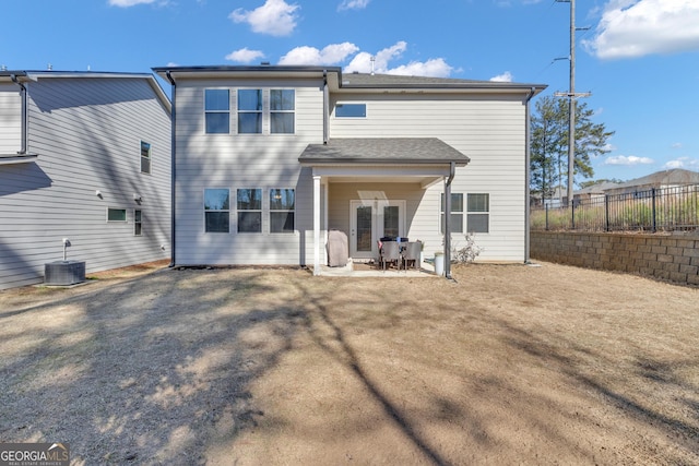 back of property featuring central AC unit and a patio area