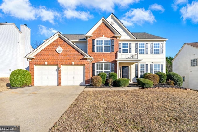 view of front of home with a balcony and a front lawn