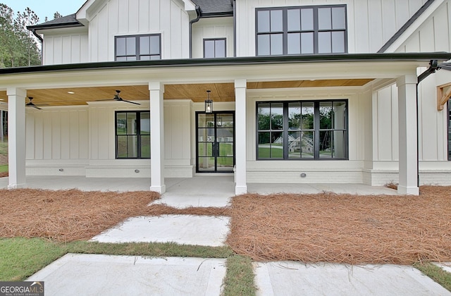 doorway to property featuring a porch and ceiling fan