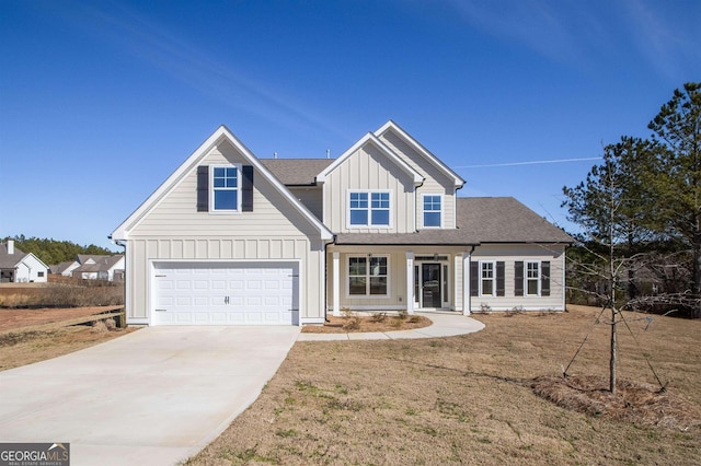 view of front of home featuring a garage and a front lawn