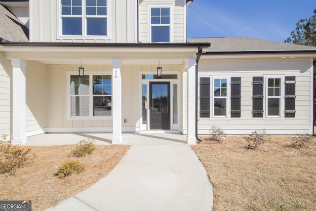 view of exterior entry featuring a porch