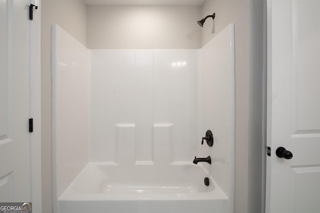 bathroom with bathing tub / shower combination