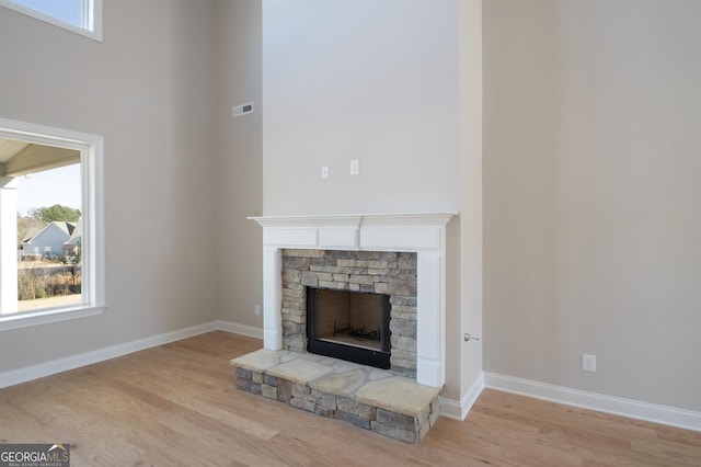 room details featuring wood-type flooring and a fireplace