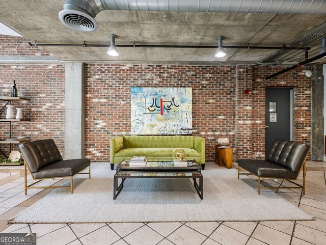 living room featuring brick wall