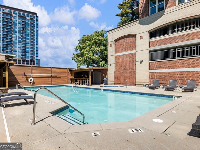 view of pool featuring a patio