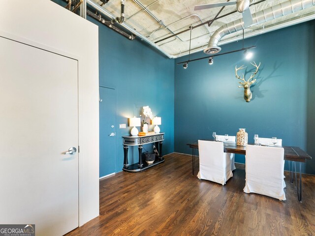 dining room featuring dark hardwood / wood-style floors and ceiling fan