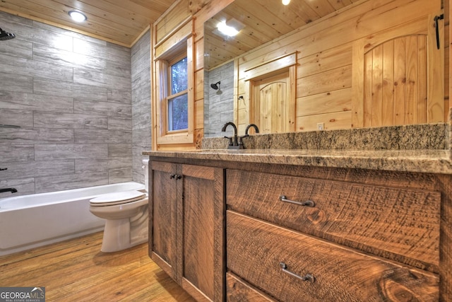 full bathroom with toilet, wood ceiling, vanity, tiled shower / bath combo, and hardwood / wood-style floors