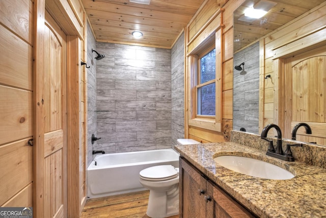 full bathroom with hardwood / wood-style floors, wood ceiling, toilet, and tiled shower / bath combo