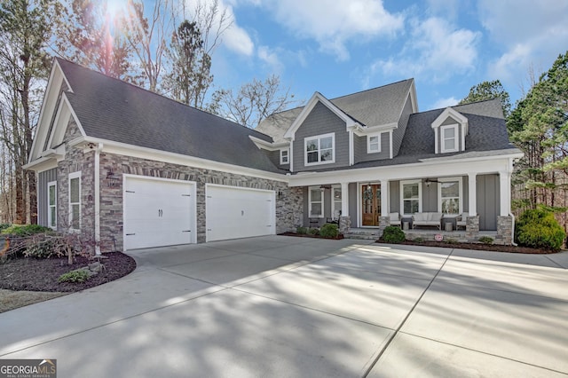 view of front of property featuring a porch and a garage