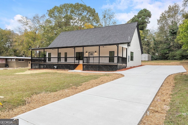 view of front of home featuring covered porch and a front yard