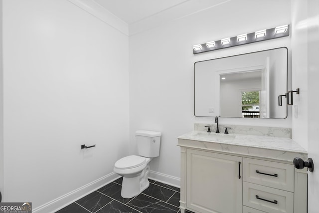 bathroom with vanity and toilet