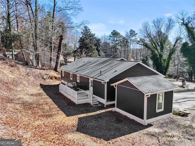 view of property exterior with covered porch