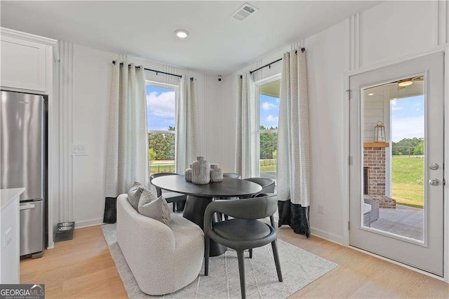 dining space featuring light hardwood / wood-style floors