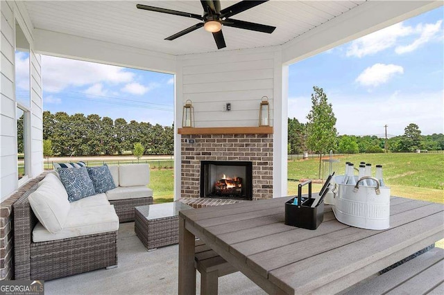 view of patio / terrace featuring an outdoor living space with a fireplace