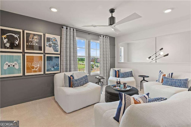 carpeted living room with ceiling fan