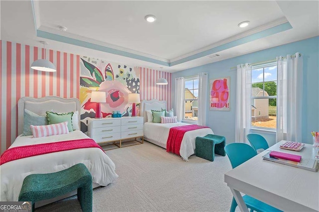 carpeted bedroom featuring a raised ceiling and ornamental molding