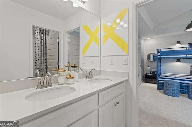 bathroom featuring ornamental molding and vanity