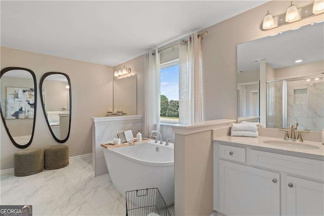 bathroom featuring vanity and separate shower and tub