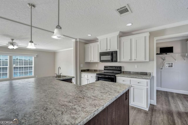 kitchen featuring pendant lighting, white cabinetry, sink, ornamental molding, and black appliances