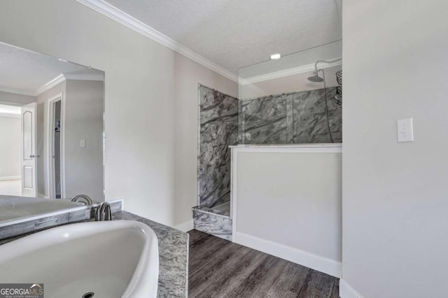 bathroom with a shower, wood-type flooring, sink, and ornamental molding