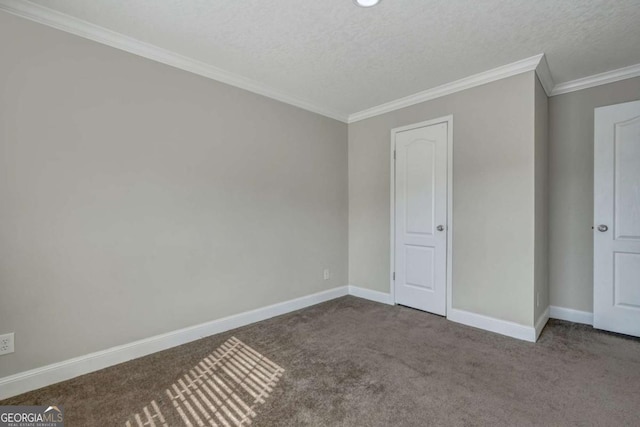 unfurnished bedroom featuring ornamental molding, a textured ceiling, and carpet flooring