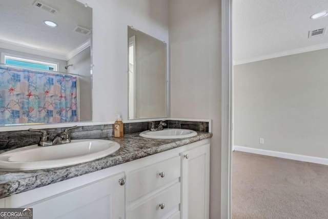 bathroom featuring vanity and ornamental molding