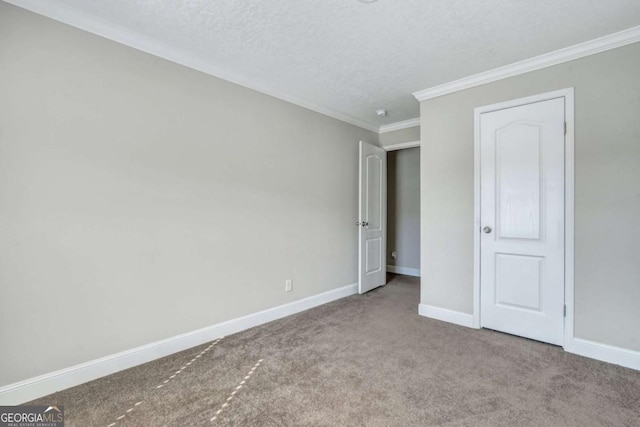 unfurnished bedroom with crown molding, carpet flooring, and a textured ceiling