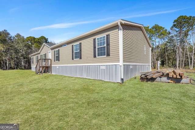 view of side of property featuring a yard